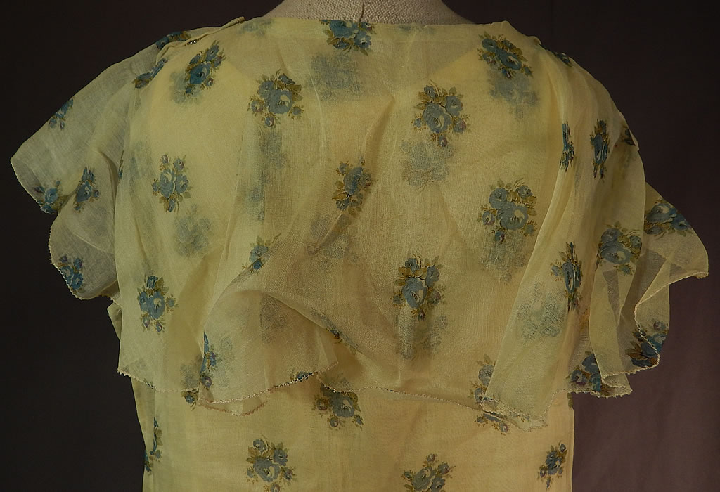 Vintage Girls Yellow Organdy Blue Floral Print Capelet Drop Waist Dress & Slip
It is in excellent condition. This is truly a wonderful and rare piece of 1920s children's wearable art! 