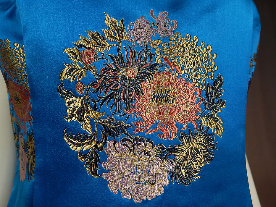 Vintage Blue Silk Chinese Chrysanthemum Brocade Sheath Dress Evening Gown
The dress measures 55 inches long, with a 36 inch bust, 32 inch waist and 40 inch hips. It is in excellent condition and beautifully made with quality workmanship. This is truly a wonderful piece of custom made Hong Kong wearable art! 