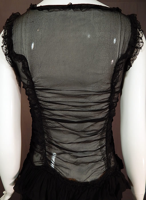 Vintage Ruched Black Silk Chiffon Lace Pink Rosette Trim Drop Waist Dress
The dress measures 45 inches long, with a 34 inch bust and 28 inch waist. It is in excellent condition. This is truly a wonderful piece of wearable art! 