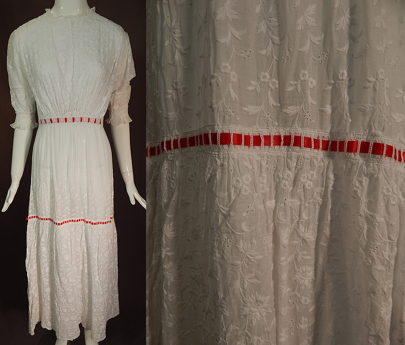 Edwardian White Cotton Batiste Floral Eyelet Embroidered Lace Lawn Dress Tea Gown
This vintage Edwardian era white cotton batiste floral eyelet embroidered lace lawn dress tea gown dates from 1910. It is made of a white cotton batiste lawn fabric, with a white raised padded satin stitch hand embroidery work whitework densely done in floral vine leaf design and eyelet drawn cutwork accents. 