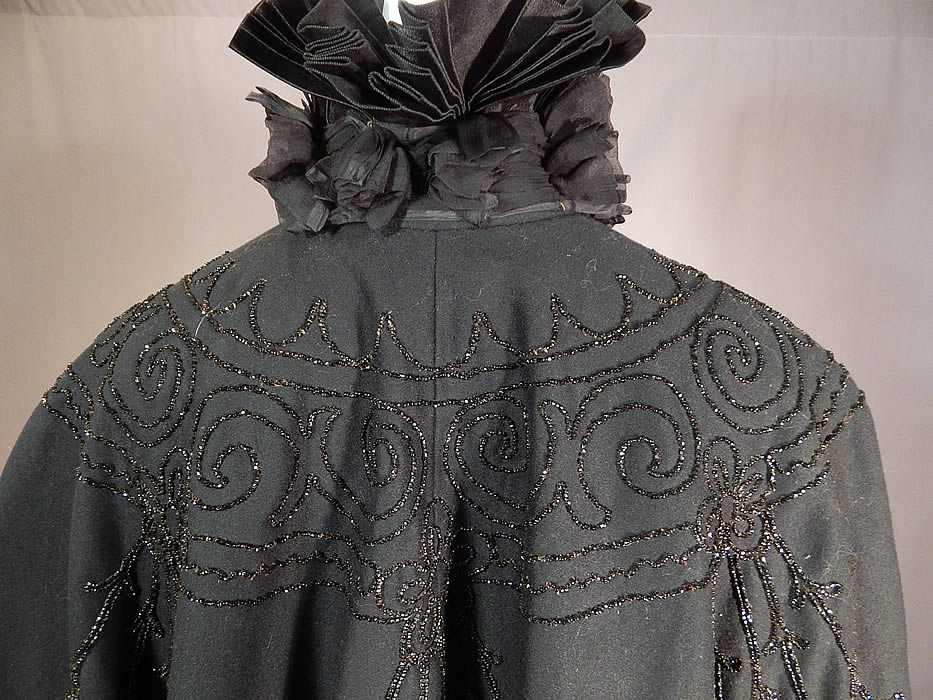 Victorian Black Wool Jet Beaded Pleated Silk High Neck Collar Winter Cloak Cape
It is in good condition, with only a few loose missing beads. This is truly a wonderful piece of antique Victoriana winter mourning wearable art!