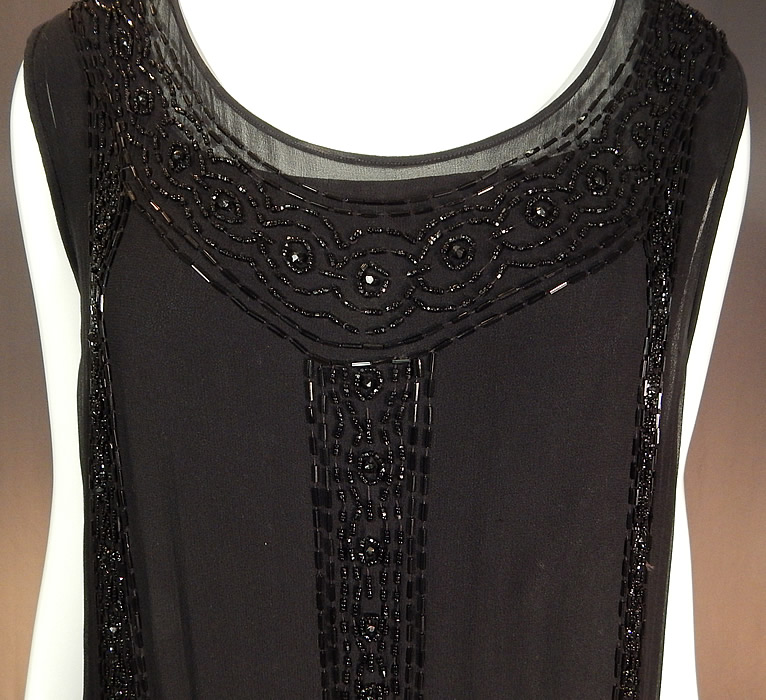 Vintage Art Deco Black Silk Beaded Butterfly Fringed Flapper Dress
There are black beaded medallions and fringe along the sides.