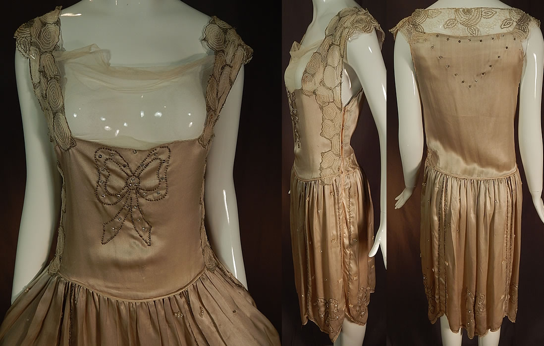 Vintage Gray Silk Rhinestone Silver Beaded Bow Handkerchief Hem Flapper Dress
This fabulous flapper dress has a drop waist style with a scalloped handkerchief hem skirt, sleeveless, side snap closures and is sheer, unlined. 