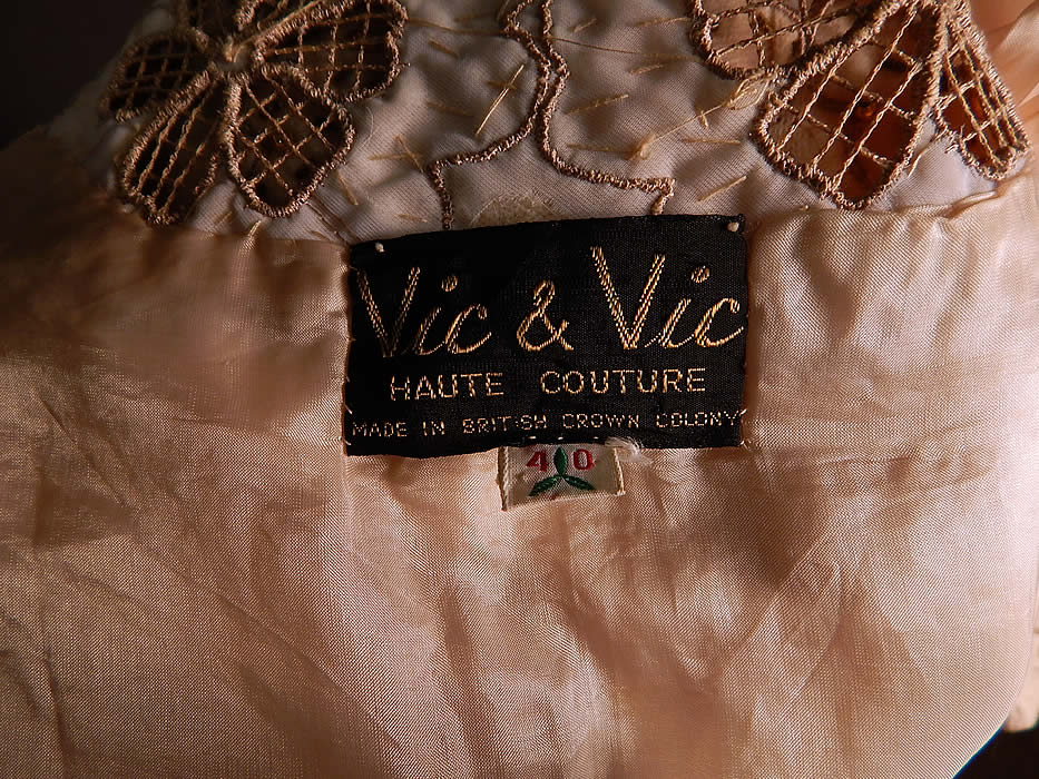 Vintage Vic & Vic Haute Couture Hong Kong Beaded Cutwork Cardigan Sweater
There is a "Vic & Vic Haute Couture Made in British Crown Colony Hong Kong" label and size 40 tag sewn inside. The sweater measures 20 inches long, with a 38 inch bust, 34 inch waist, 20 inch long sleeves and a 13 inch back. It is in excellent condition. This is truly a wonderful piece of wearable art! 