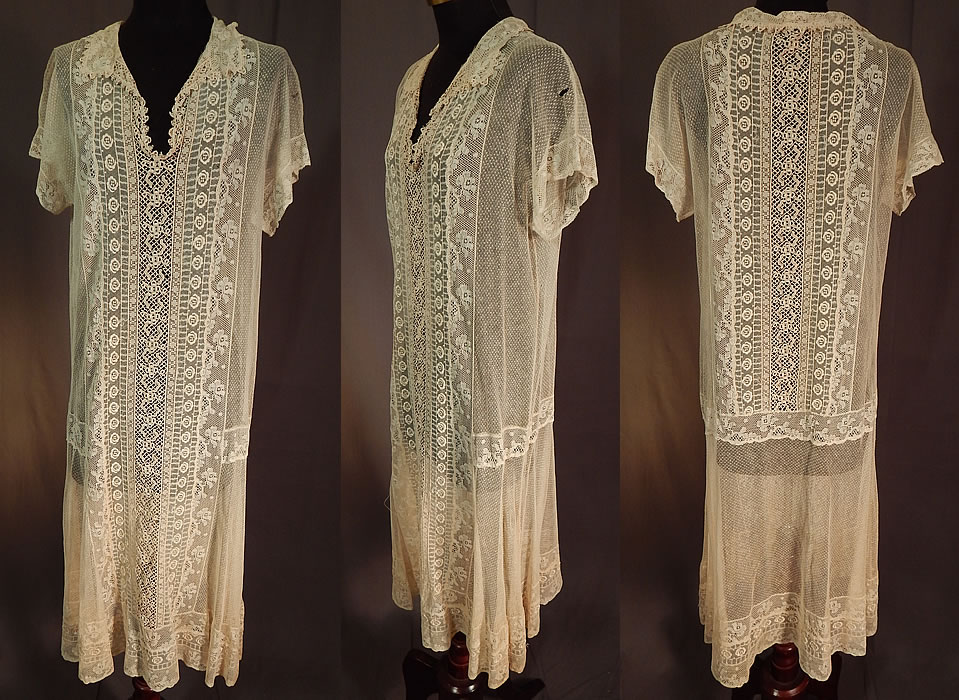 Vintage Embroidered Cream Net Filet Crochet Mixed Lace Drop Waist Shift Dress
This vintage embroidered cream net filet, crochet, mixed lace drop waist shift dress dates from the 1920s. It is made of an off white cream color sheer tulle net fabric with a Swiss dot design, raised padded satin stitch embroidery work of flowers and a patchwork of mixed laces, filet, crochet and Valenciennes lace trimmings.