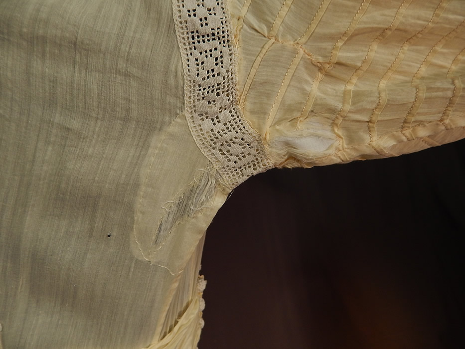 Victorian Yellow Cream Cotton Batiste White Lace Lawn Dress Tea Gown
It is in fair as-is condition, with some fade discoloration in areas, several tiny frays scattered and a patched repair under one arm with fraying under the sleeve (see close-up). Great for design and restoration! This is truly a wonderful piece of wearable antique lace art! 