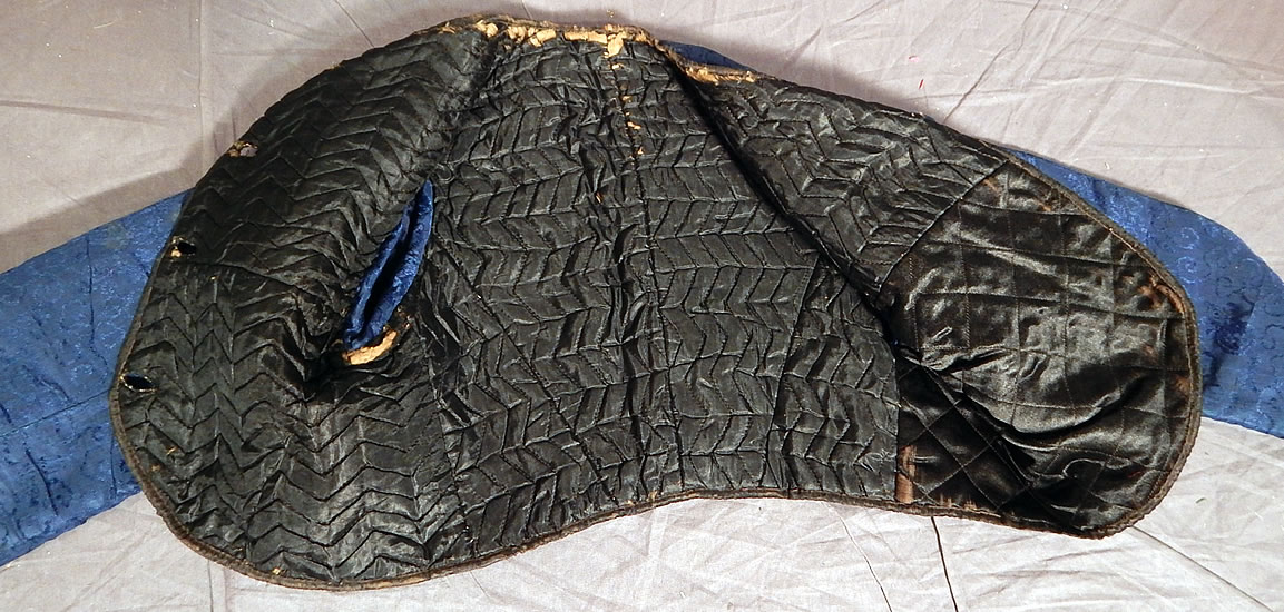 Victorian Antique Chinese Blue Silk Damask Brocade Quilted Boys Child Coat Jacket
The coat measures 12 inches long, with a 24 inch chest, 24 inch waist, 12 inch long sleeves and 9 inch back.