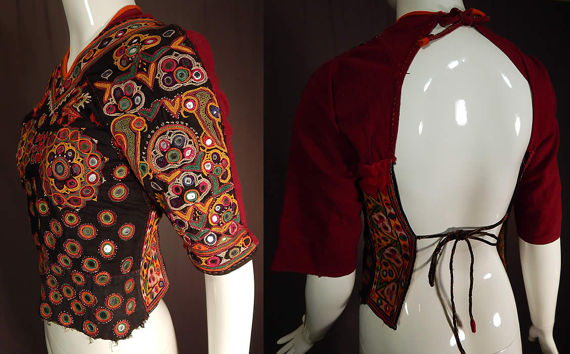 Vintage Indian Gujarati Kutch Work Embroidered Mirror Choli Boho Blouse Top
There are small mirrors embroidered into the decorative designs of flowers, animals and circular medallions over the breasts. 