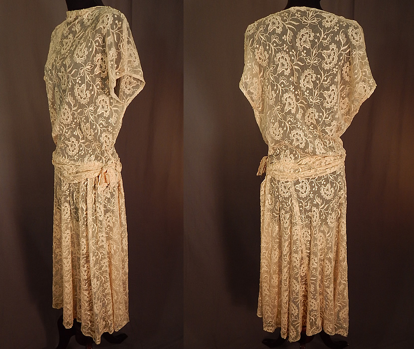 Vintage Cream Tulle Net Tambour Embroidery Floral Lace Belted Dress
This lovely lace dress has a fitted style, with belted side sash drape bow trim, short cap sleeves, a high neckline, shoulder, side snap closures and is sheer, unlined. 