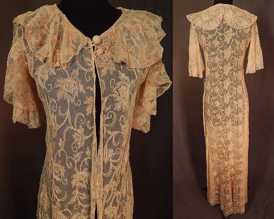 Vintage Blush Pink Tulle Net Tambour Embroidery Floral Lace Dressing Gown Robe
This lovely lace dressing gown boudoir robe has a long floor length, fitted style, with a scalloped shawl collar, short flared batwing sleeves, two fabric covered buttons at the neck, a single side snap closure at the waist and is sheer, unlined.