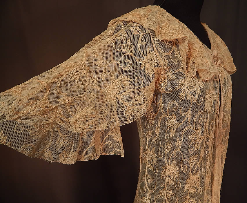 Vintage Blush Pink Tulle Net Tambour Embroidery Floral Lace Dressing Gown Robe
The dress measures 57 inches long, with a 34 inch bust, 26 inch waist and 12 inch back.