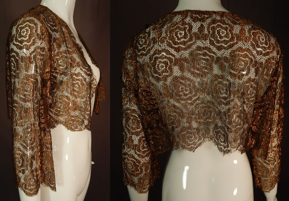 Vintage Art Deco Gold Metallic Lam&eacute; Lame Lace Crop Top Bolero Jacket Shrug
This Art Deco vintage gold metallic lam&eacute; lace crop top bolero jacket shrug dates from the 1930s. It is made of a sheer gold metallic thread lam&eacute; lace net woven spiral abstract floral leaf design pattern fabric.