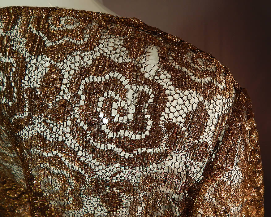 Vintage Art Deco Gold Metallic Lam&eacute; Lame Lace Crop Top Bolero Jacket Shrug
It is in good as-is condition with only a few small frayed breaks in the lace on the shoulders (see close-ups). This is truly a rare and exceptional piece of Art Deco wearable textile art!