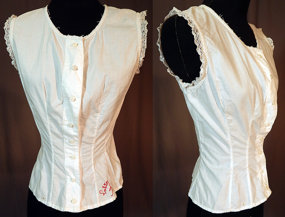 Victorian Lolita Lingerie White Cotton Lace Trim Camisole Corset Cover Top
This lovely lingerie camisole corset cover top undergarment has a form fitting style, sleeveless, with tiny mother of pearl button closures down the front. The top measures 18 inches long, with a 32 inch bust and 22 inch waist.