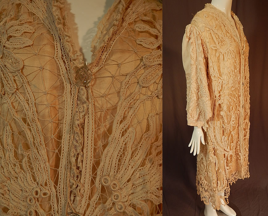 Edwardian Antique Cream Silk Lined Battenburg Tape Lace Long Coat Jacket
This lovely lace coat jacket is a long below the knee length, with a loose fitting style, gathered shoulders, long full sleeves with flared wide cuffs coming to a point, gold etched glass button closures down the front and is fully lined in a cream color silk satin backing lining. 