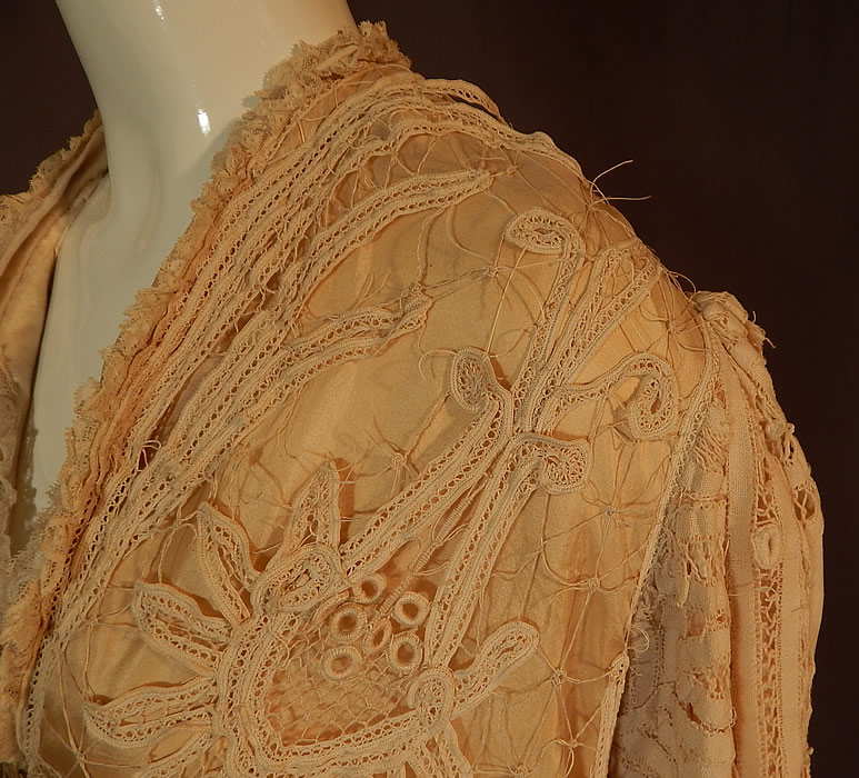Edwardian Antique Cream Silk Lined Battenburg Tape Lace Long Coat Jacket
It is in good as-is condition, needing some restoration repairs, with several breaks in the lace and some fraying on the inside silk lining along the shoulders and neckline (see close-ups). 