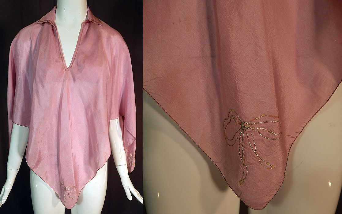 Vintage Lilac Silk Silver Bow Painted Trim Lingerie Boudoir Bed Jacket Poncho Cape
This vintage lilac silk silver bow painted trim lace lingerie boudoir bed jacket poncho cape dates from the 1930s. It is made of a light purple lilac color silk fabric with hand painted silver ribbon bow trim accents on each of the four corners and silver metallic thread drawn cutwork trim edging. 