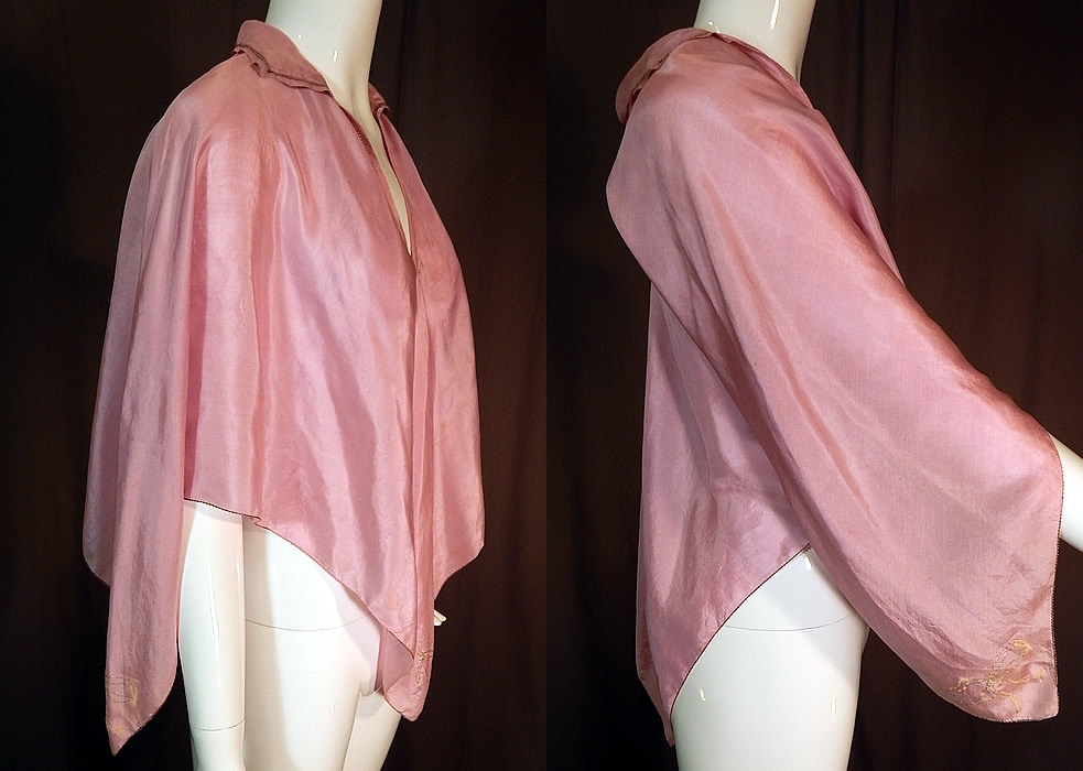 Vintage Lilac Silk Silver Bow Painted Trim Lingerie Boudoir Bed Jacket Poncho Cape
This lovely lingerie boudoir bed jacket poncho cape top has an over the head loose fitting style, created from a square piece of fabric with batwing sleeves coming to a point on the sides, the front and back, with a fold over collar, V front neckline and is unlined. The top measure 28 inches long, with a 15 inch back.