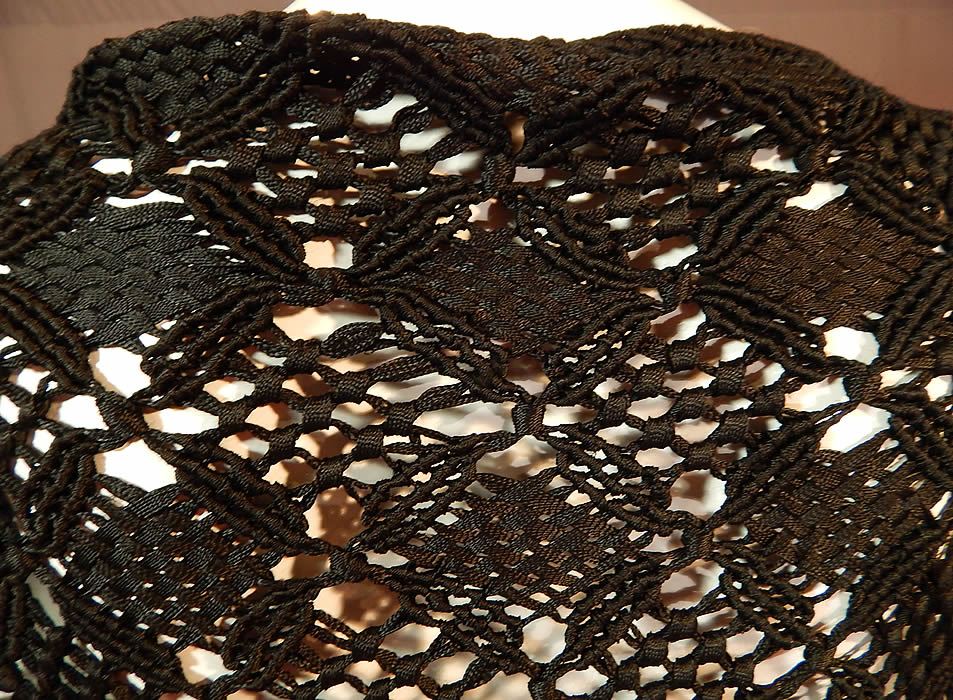 Vintage Black Gothic Silk Ribbon Macrame Crochet Hand Knot Fringe Boho Shawl
The shawl is heavy weighing 4 pounds, measures 54 inches long in the center, 75 inches wide across the top and has 18 inch long fringe. It is in excellent condition. This is truly a wonderful piece of wearable boho Gothic textile art! 