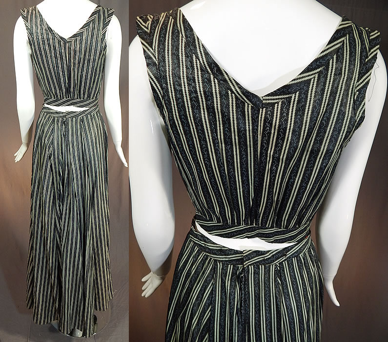 Victorian Blue & Black Striped Print Cotton Chintz Calico Dress Blouse Skirt
This womens work wear two piece day dress has a short crop over top style camisole sleeveless shirt blouse, with key hole cut out openings on the sides, an open front with a single hook closure on the fitted waistband and is unlined. The top measures 15 inches long, with a 34 inch bust and 24 inch waist. 