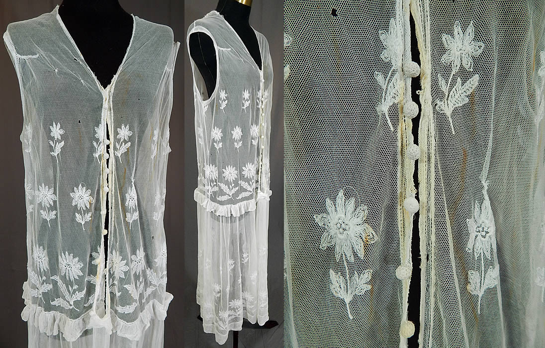 Vintage White Tulle Net Tambour Embroidery Lace Daisy Drop Waist Dress
This lovely lace, loose fitting, drop waist style dress is sleeveless, with a ruffle flounce trim edging around the hips, an open front with no closure, only decorative tiny crochet button trim and is sheer, unlined. The dress measures 48 inches long, with a 32 inch bust and 40 inch waist. It is in fair as-is condition, with some faint yellowing discoloration stains on the front top, fraying along the neckline edging and several tiny holes scattered (see close-ups). This is truly a wonderful piece of wearable lace art!
