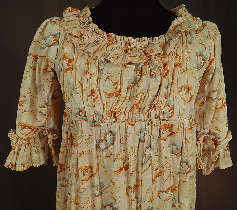 Victorian Girls Art Nouveau Floral Print Cotton Empire Waist Regency Style Dress
This young ladies Jane Austen Regency inspired dress has an empire silhouette fitted under the bust and falling loosely below, matching fabric ruched ruffle trim edging the neckline, sleeve cuffs and bottom skirt hemline, with hook closures on the back top and is lined in a cotton muslin fabric. 