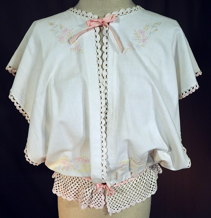Edwardian White Linen Pastel Embroidered Crochet Lace Combing Bed Jacket
This vintage Edwardian era white linen pastel embroidered crochet lace combing bed jacket dates from 1910. 