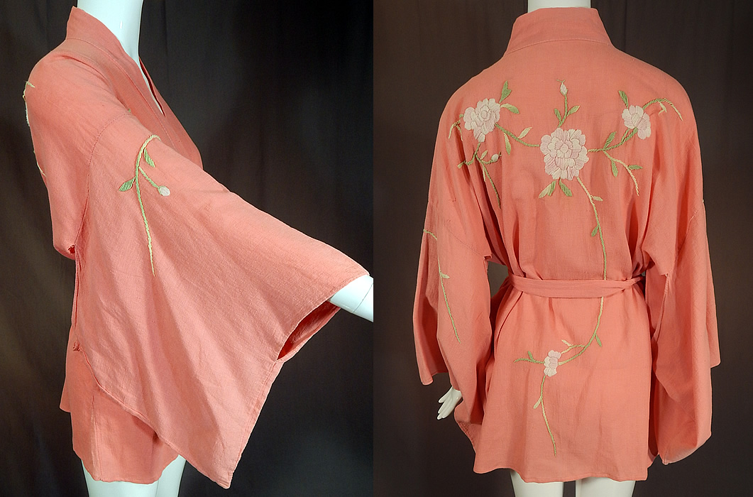Vintage Japanese Pink Peony Floral Embroidered Muslin Belted Kimono Robe
This pretty pink Japanese kimono short robe jacket has an open front with a matching fabric sash tie belt for closure, full kimono sleeves and is unlined. The kimono measures 30 inches long, with a 48 inch chest, 48 inch waist, 25 inch back and 53 inch long sash belt.