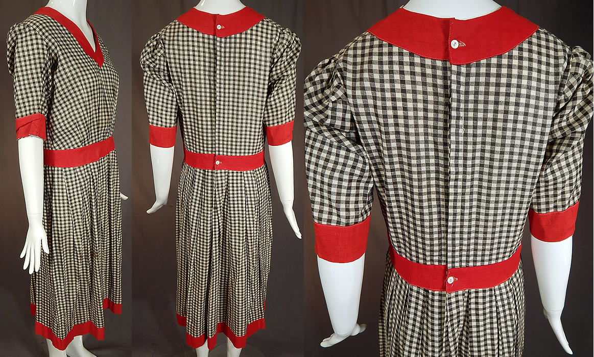 Vintage Edwardian Black & White Cotton Gingham Plaid Red Trim Swimsuit Dress
This wonderful women's old fashioned bathing suit costume dress has a V front neckline, short sleeves, a fitted waistband, button closures down the back and is missing the bloomers pantaloons which would have been worn underneath. The dress measures 45 inches long, with a 38 inch bust, 30 inch waist, 60 inch hips and a 13 inch back. 