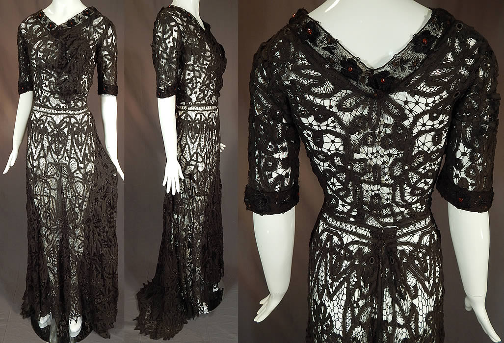 Edwardian Antique Black Battenburg Tape Lace Amber Beaded Gown Dress
There is black net embroidered flowers, amber beaded trim edging the neckline and sleeve cuffs. This lovely lace black ball gown dress is a long floor length with slight back train skirt, V necklines, short sleeves, fitted waistband, hook closures on the back, side, shoulder and is sheer, unlined.