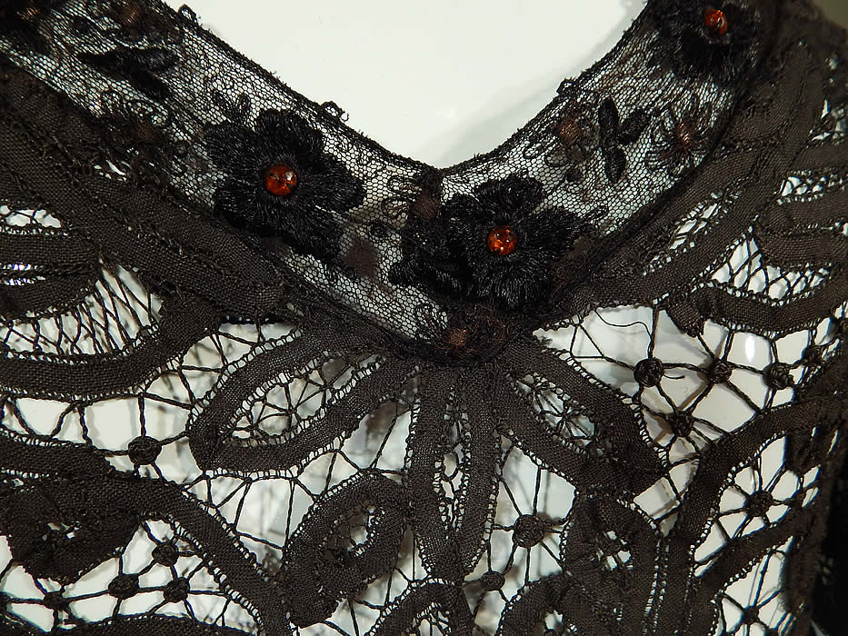 Edwardian Antique Black Battenburg Tape Lace Amber Beaded Gown Dress
The dress measures 64 inches long in the front, 72 inches long in the back, with a 36 inch bust, 23 inch waist, 54 inch hips and 15 inch back. It is in good condition, with some gathered, layering of the lace fabric on one side of the top. This is truly an exceptional piece of antique lace wearable art! 