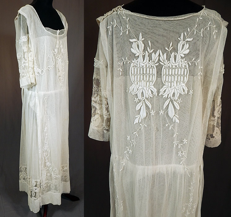 Vintage Embroidered French Knot White Net Crochet Filet Lace Tabard Top Dress
This lovely lace dress has a layered style with attached tabard overdress, open sides, snap closures on the shoulder and waist, a short sleeve underdress with squared neckline, a fitted waistband, tiny mother of pearl button closures on front camisole top lining inside.