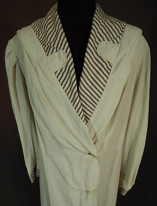 Vintage Linen Striped Sailor Shawl Collar Womens Duster Driving Motoring Coat
This wonderful women's duster motoring coat is a long floor length, with a wide lapel shawl sailor style collar, gathered shoulders, long sleeves with rolled cuffs, 3 large mother of pearl buttons on the side front for closure and is unlined. 