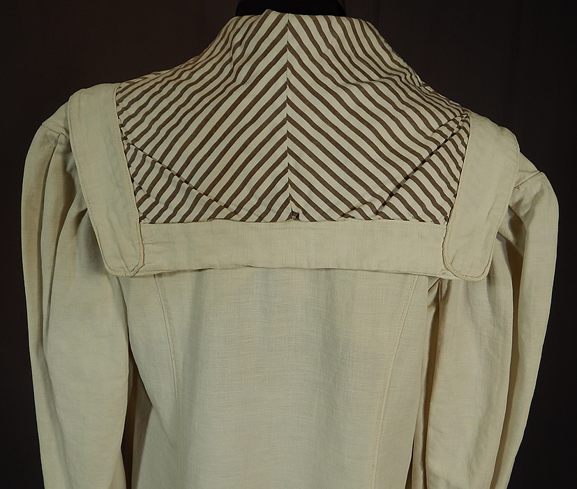 Vintage Linen Striped Sailor Shawl Collar Womens Duster Driving Motoring Coat
The coat measures 49 inches long, with a 36 inch bust, 32 inch waist, 44 inch hips, 14 inch back and 23 inch long sleeves. This coat would have been worn to protect ones clothing from the dust and mud when traveling, riding and driving in a motor car.