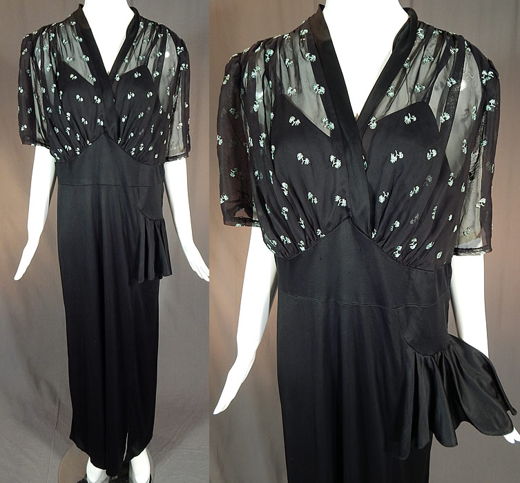 Vintage Blue Embroidered Flowers Black Silk Jersey Maxi Evening Gown Dress
This vintage blue embroidered flowers black silk jersey maxi evening gown dress dates from the 1940s. It is made of a black silk jersey knit fabric, with a sheer black top embellished with tiny embroidered baby blue flowers. 