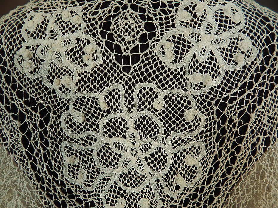 Victorian Handmade Bobbin Tape Lace Net White Bolero Jacket Shrug Top
It is in good condition, with a small faint age spot stain along the bottom back hem and a few small breaks in the lace. This is truly a wonderful piece of antique Victoriana handmade lace wearable art!