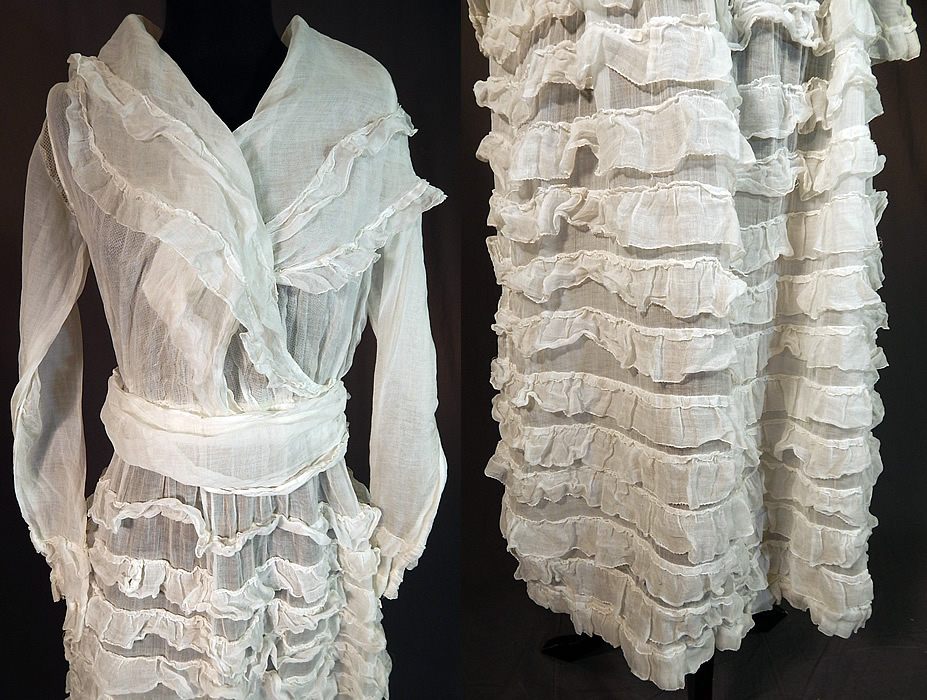 Edwardian White Cotton Organdy Ruffled Fichu Belted Dress Tea Gown
This charming colonial inspired dress is a long tea length, with a fichu style shawl collar wrap front neckline, long sleeves with ruffled cuffs, a belted sash waist, snap closures on the side, waist, a full ruffled skirt and is lined inside the top only in a sheer white net fabric camisole with hook closures down the front. 
