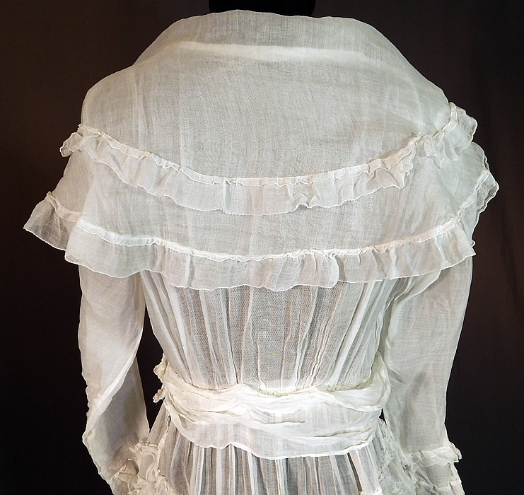 Edwardian White Cotton Organdy Ruffled Fichu Belted Dress Tea Gown
The dress measures 47 inches long, with a 36 inch bust, 25 inch waist, 44 inch hips, 22 inch long sleeves and a 12 inch back. It is in excellent condition. This is truly a wonderful piece of wearable art! 