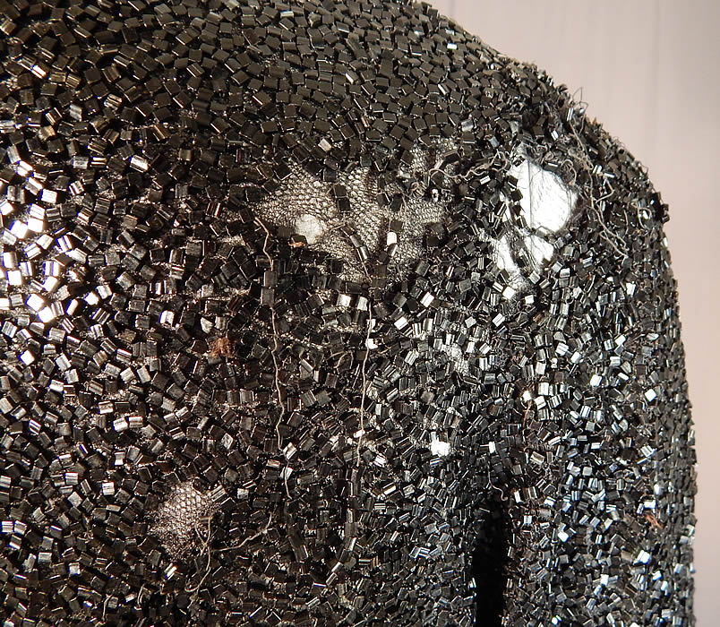 Vintage Art Deco Fully Black Beaded Flapper Evening Coat Crop Bolero Jacket
The jacket measures 23 inches long, with a 40 inch bust, 32 inch waist, 13 inch back, 15 inch long sleeves and is quite heavy weighing 4 pounds. 