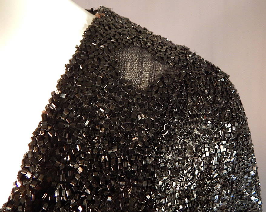 Vintage Art Deco Fully Black Beaded Flapper Evening Coat Crop Bolero Jacket
It is in good as-is condition, needing some restoration on the back shoulder with a small frayed hole and some loose, missing beads mostly on the one shoulder area (see close-ups).