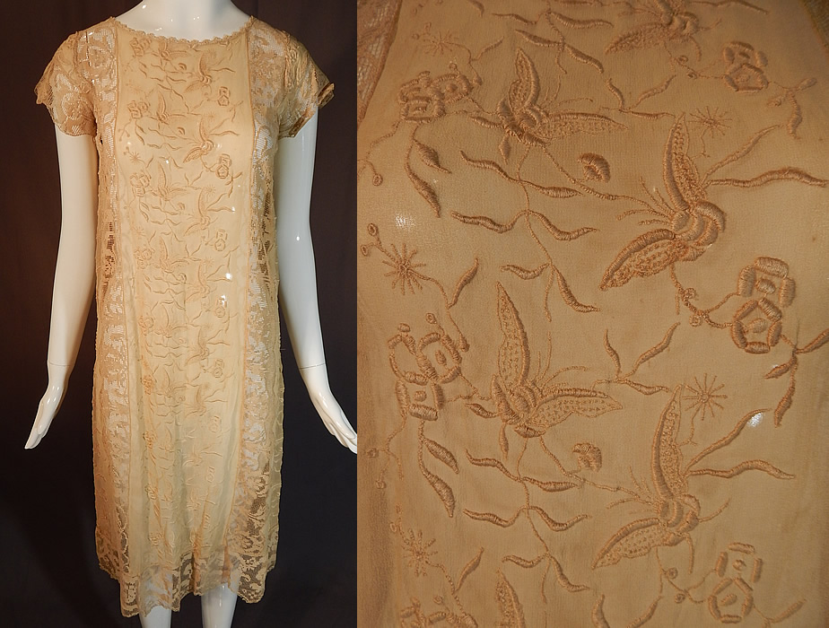 Vintage Butterfly French Knot Embroidered Ecru Silk Filet Lace Chemise Shift Dress
This vintage butterfly French knot embroidered ecru silk filet lace chemise shift dress dates from the 1920s. It is made of an ecru cream color sheer silk fabric, with raised padded satin stitch and French knot embroidery work done in butterfly, vine leaf designs and filet lace trim inserts with floral pattern.