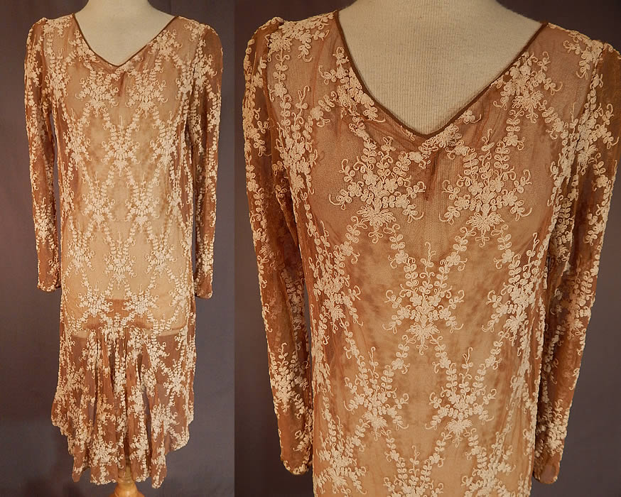 Vintage Ecru Beige Tulle Net Tambour Embroidery Lace Drop Waist Dress
This vintage ecru beige tulle net tambour embroidery lace drop waist dress dates from the 1920s. It is made of an ecru beige color sheer tulle net fabric with off white cream color tambour embroidery work of a floral vine leaf lace pattern design. 