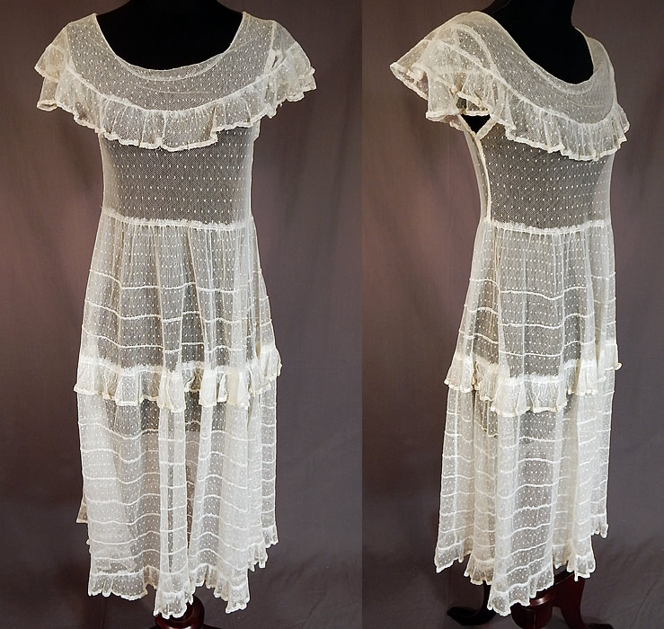 Vintage Swiss Polka Dot White Tulle Net Lace Shawl Collar Capelet Dress
This vintage Swiss polka dot white tulle net lace shawl collar capelet dress dates from the 1930s. It is made of a white sheer tulle net fabric with a woven Swiss dot, polka dot pattern and pleated ruffle trim edging.
