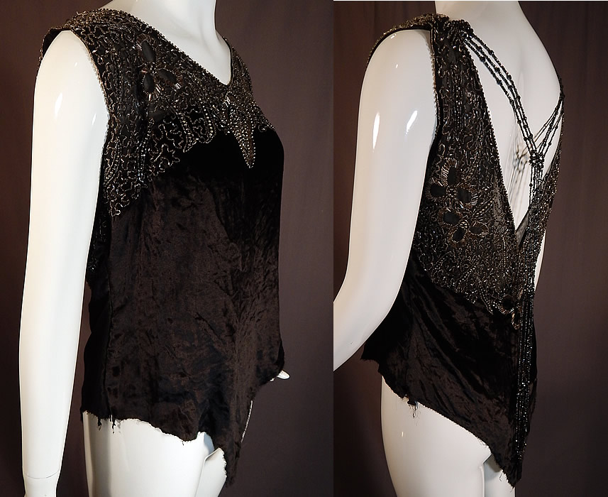Vintage Art Deco Black Velvet Silver Studded Beaded Fringe Flapper Blouse Top
This fabulous flapper dress blouse top has a loose fitting, sleeveless style which comes to a V point on the bottom, has a sexy low plunging V back with beaded necklace strands of fringe trim attached on the shoulders and hanging loosely down the back. 