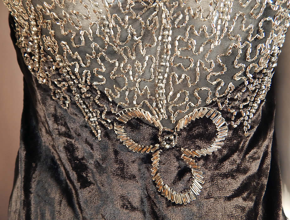 Vintage Art Deco Black Velvet Silver Studded Beaded Fringe Flapper Blouse Top
The top measures 30 inches long in the front and back, 20 inches long on the sides, with a 36 inch bust and 32 inch waist.