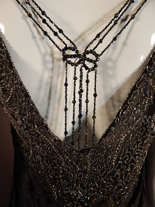 Vintage Art Deco Black Velvet Silver Studded Beaded Fringe Flapper Blouse Top
It is in good condition, with only a few loose missing beads and appears to have been cut along the bottom with some fraying and needing a hem sewn in. This is truly a beautiful piece of wearable Art Deco beaded textile art! 