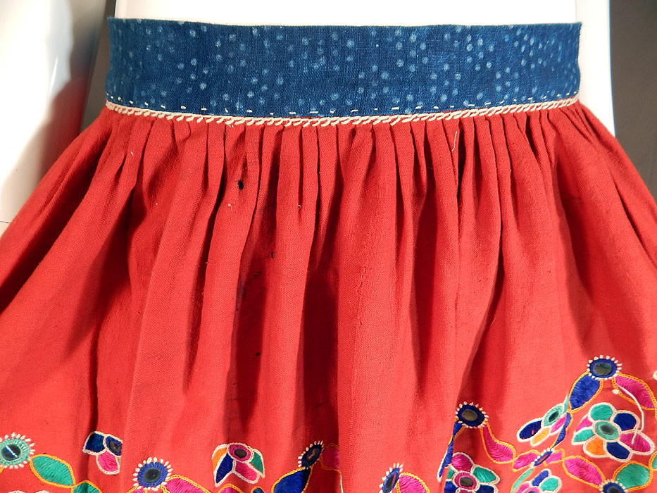 Vintage Afghanistan Ahir Banjara India Ghagra Kutch Mirrorwork Embroidery Skirt
The skirt measures 34 inches long, with a 30 inch waist and 70 inch hips. It is in good condition, with only a few cracks in the mirrors and slight imperfections.