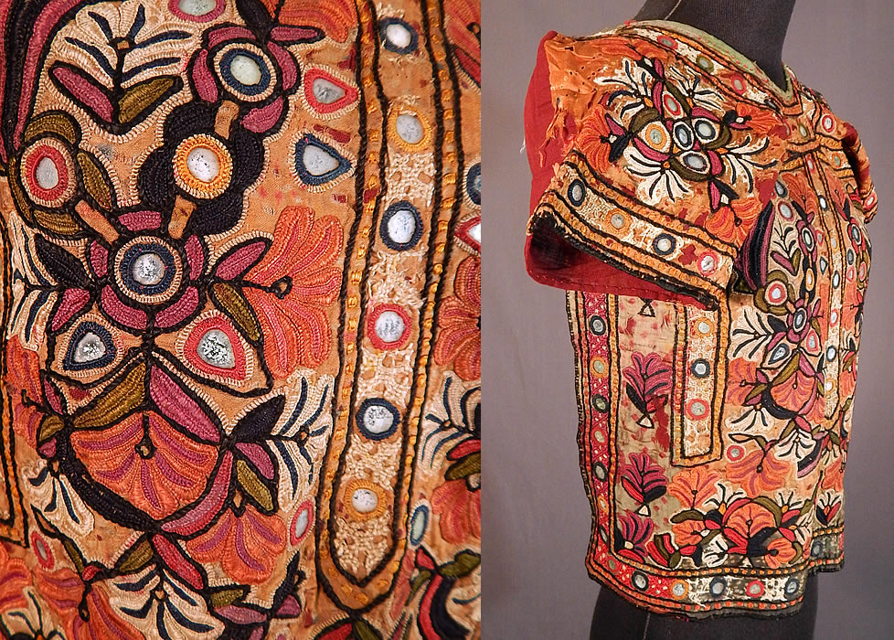 Vintage Indian Gujarat Kutch Work Embroidery Mirrorwork Choli Boho Blouse Top
It is hand stitched, made a hand dyed fine silk fabric sewn onto and backed with a dark red burgundy color cotton twill woven fabric, with colorful kutch embroidery work, chain stitching and buttonhole stitching surrounding small glass mirrors creating an ethnic floral design. 