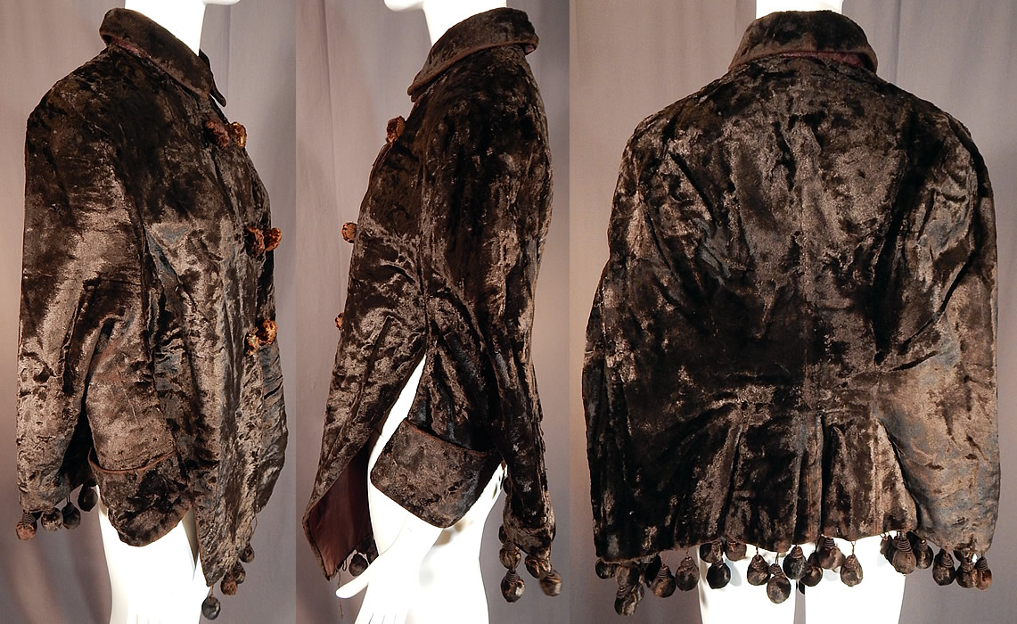 Victorian Womens Plush Velvet Beaver Fur Winter Dolman Mantle Cape Coat
This wonderful womens winter dolman mantle cape coat is a mid hip length with long lappet panels hanging down the front, velvet ball fringe trim attached around the bottom hem, partially set in sleeves, rolled cuffs, a loose fitting cape back, an upturned collar which can be worn folded down, fur button toggles and hidden inside brown silk button closures down the front and is fully lined in a brown silk fabric. 