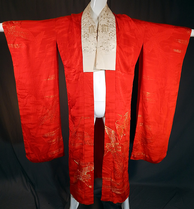 Vintage Japanese Red Silk Gold Embroidered Cranes Furisode Ceremonial Kimono
This vintage Japanese red silk gold embroidered cranes furisode ceremonial kimono dates from during the Showa period in the 1930s. It is made of a scarlet red color silk damask weave fabric with a woven flying crane design and gold metallic thread couching embroidery work of more crane birds in flight.